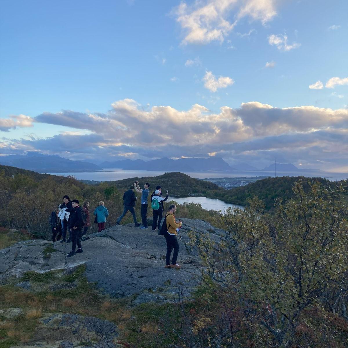 People standing on the edge of a cliff. 